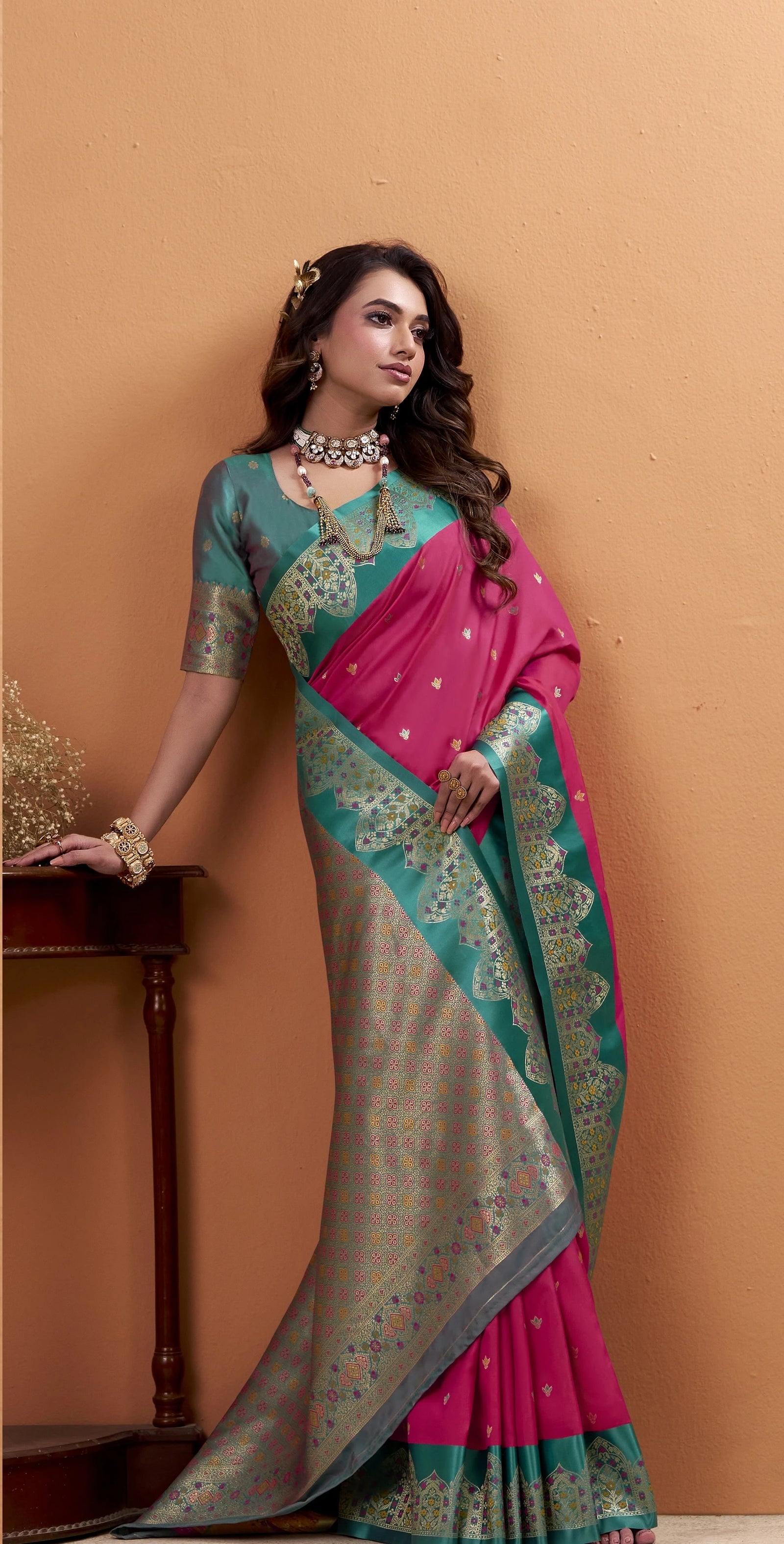 Dark pink linen silk saree with floral print, paired with a matching blouse piece. The saree has a soft sheen, lightweight drape, and is designed for festive and reception wear.