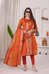 Woman wearing an orange traditional outfit with a white background