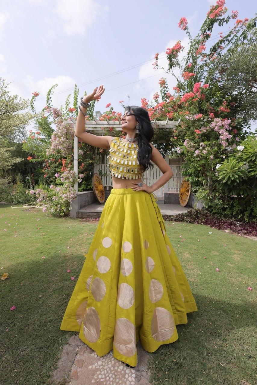 Designer festive lehenga crafted with shimmering mirror embellishments and premium fabric for a vibrant ethnic look.