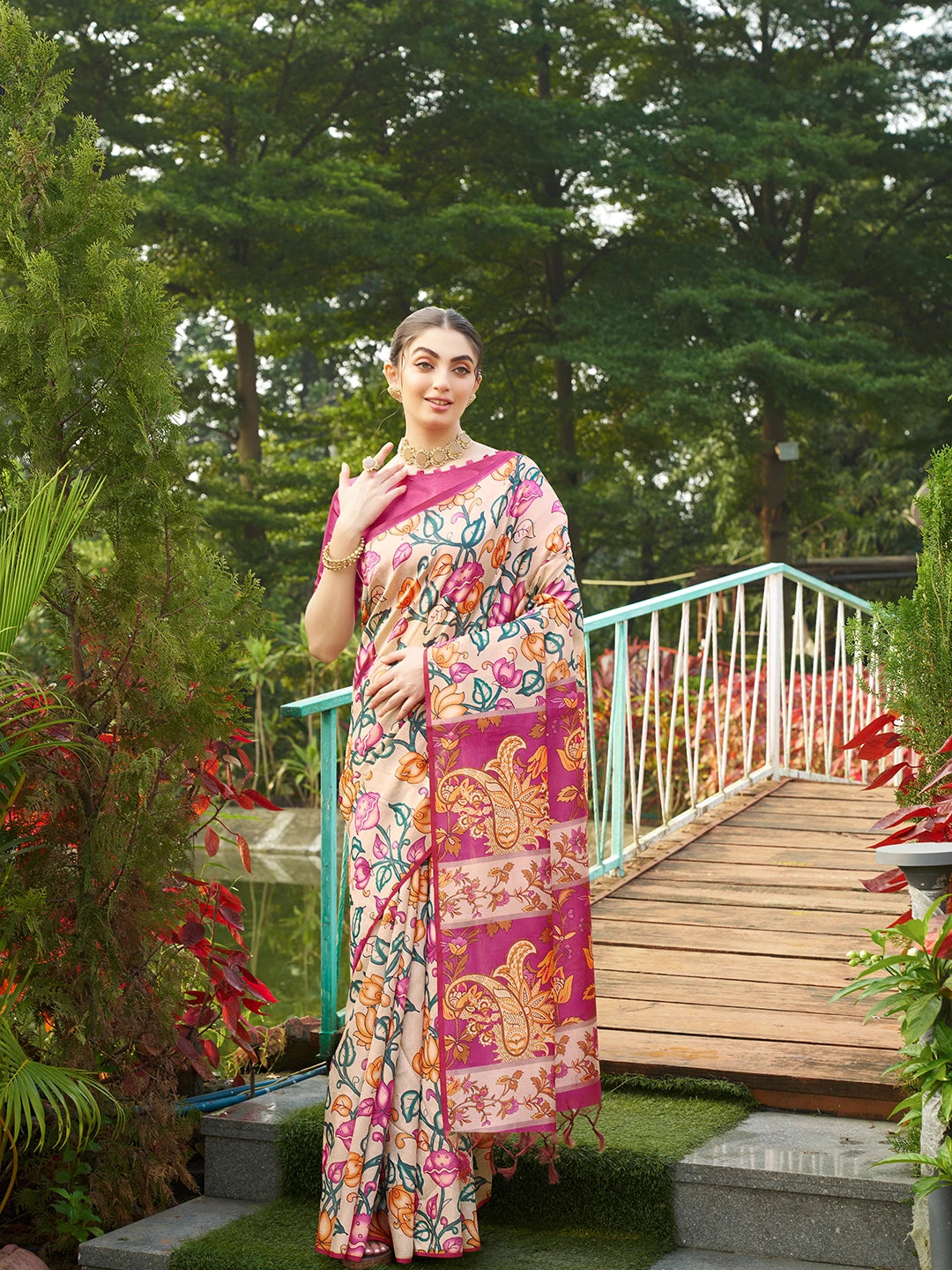 Premium beige floral printed saree with artistic magenta woven pallu and graceful traditional look.