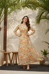 Woman in a floral dress standing in a sunlit room with plants