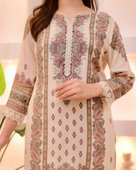Beige embroidered dress with intricate patterns on a blurred background