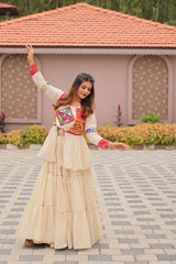 Woman in traditional outfit dancing outdoors with a house and garden in the background