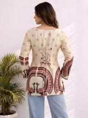 The top features maroon geometric and ornamental border patterns with a relaxed fit