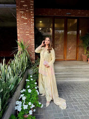 Designer beige satin silk suit with shimmering sequins showcased online