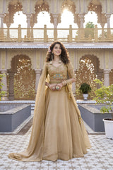 Woman in a beige traditional outfit standing in front of an ornate building with floral decorations.