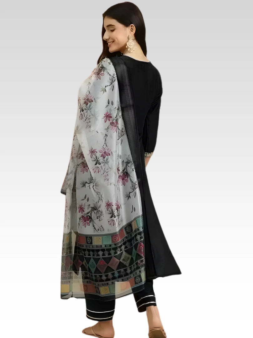 Woman wearing a traditional outfit with a floral dupatta on a white background