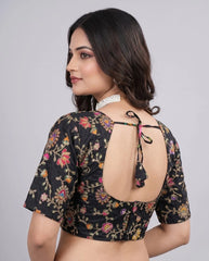Detailed embroidery and position print on black viscose blouse fabric.