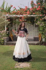 Designer White Lehenga Set featuring Black Embroidered Blouse, Multicolor Ethnic Motifs, and Contrast Border