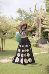 Premium black party wear lehenga designed with luxurious detailing and elegant traditional craftsmanship.