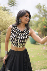 Elegant women's ethnic outfit enhanced with statement earrings and traditional accessories for a complete festive look.