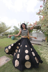 Contemporary mirror work blouse paired with a statement skirt creates a bold and graceful traditional look.