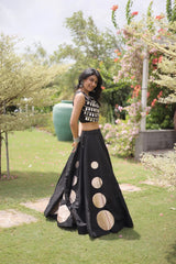 Sleeveless embellished blouse with intricate mirror work creates a stunning festive and party-ready appearance.