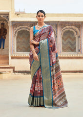 Woman wearing a traditional saree in an ornate indoor setting