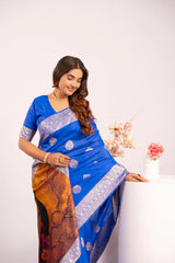 Woman wearing a blue saree with a white border on a white background