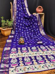 Blue saree with white floral patterns on a wooden surface