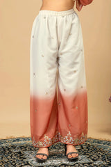 White and pink gradient pants with floral embroidery on a beige background