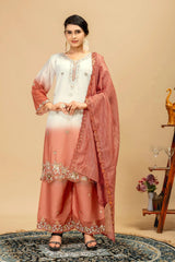Woman wearing a peach and white traditional outfit with a beige background