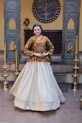 Woman in traditional outfit standing in a decorated room with ornate walls and decor.