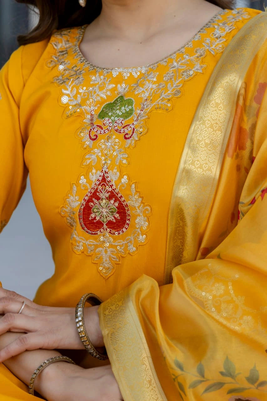 Yellow embroidered traditional outfit with gold border