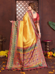 Luxurious soft pure Banarasi tissue silk saree in brown-yellow shade featuring traditional zari patterns.