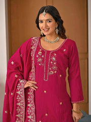 Full-length crimson red embroidered suit styled with matching dupatta and pants.