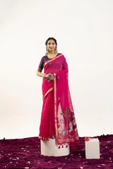 Woman wearing a pink saree with a white background