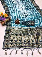 Traditional patterned fabric with tassels on a white background