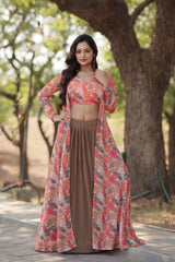 Woman in a floral outfit standing outdoors with trees in the background