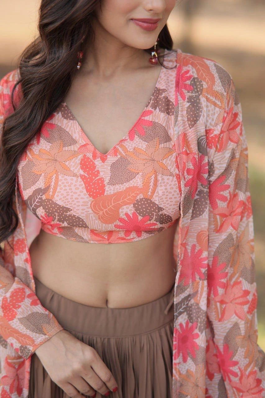 Woman wearing a floral top and beige skirt with a blurred background
