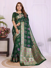 Woman wearing a green saree with floral patterns on a white background