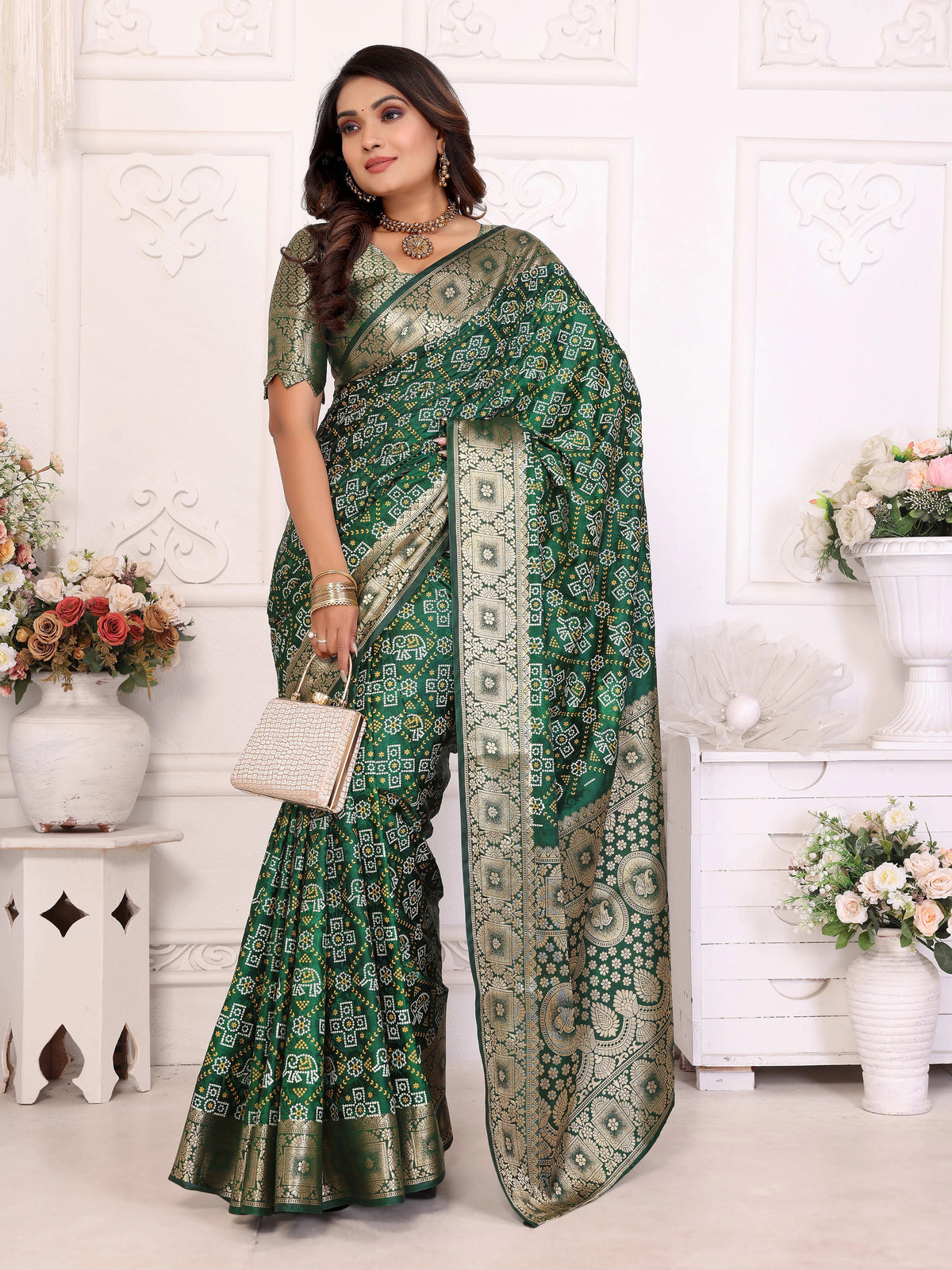Woman wearing a green saree with a white background