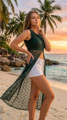 Woman on a beach with palm trees and sunset in the background