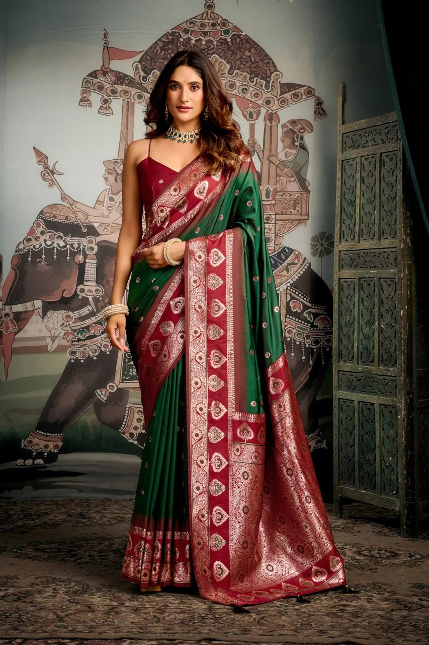 Woman wearing a green and red saree with a decorative background
