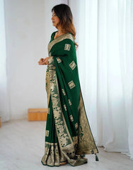 Woman wearing a green saree with a white background