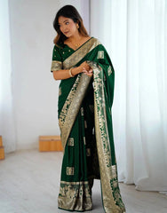 Woman wearing a green saree with a white background