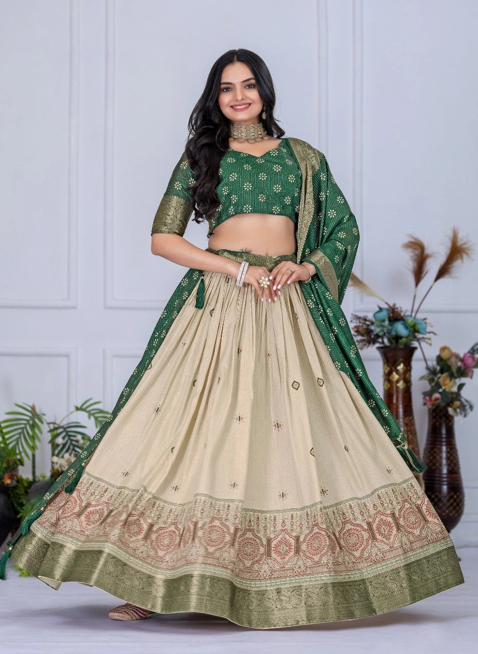 Woman wearing a green and beige traditional outfit with floral patterns.