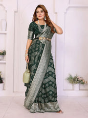 Woman wearing a green and gray saree with a white background
