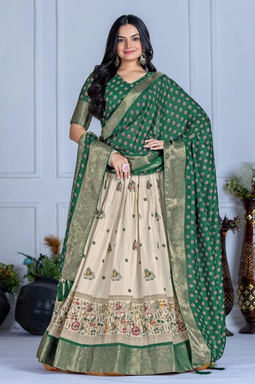 Woman wearing a green and beige traditional outfit with floral patterns indoors.