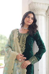Elegant velvet suit in deep blue shade with detailed embroidery and a soft shimmering dupatta, styled for a graceful festive look.