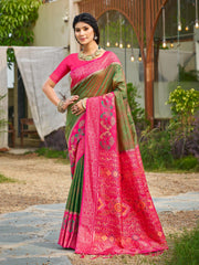 Woman wearing a pink and green saree with a garden background