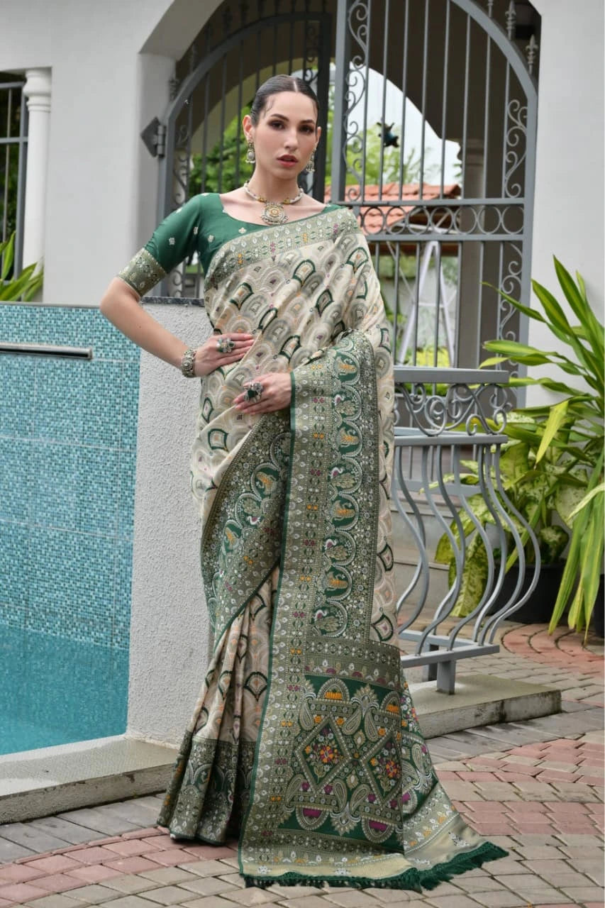 ark green Banarasi silk saree with golden zari weaving displayed on mannequin.