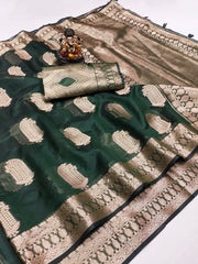 Green and beige saree with intricate patterns on a white background