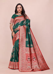 Woman wearing a green and red saree with a pattern on a beige background