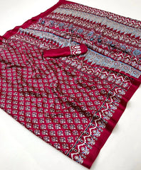Red fabric with intricate patterns on a white background