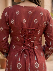 Red patterned kurta with a lace-up back, worn by a person.