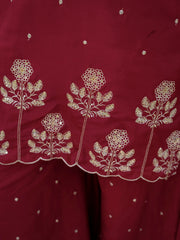 Red fabric with white floral embroidery