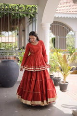 Gorgeous Rust Orange Lehenga Set with Designer Peplum Top, Flowing Layers, and Festive Golden Border Finish