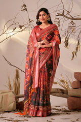 Woman wearing a red and black saree with a pattern, standing against a neutral background.