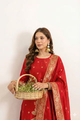 Woman in a red traditional outfit holding a basket with a white background